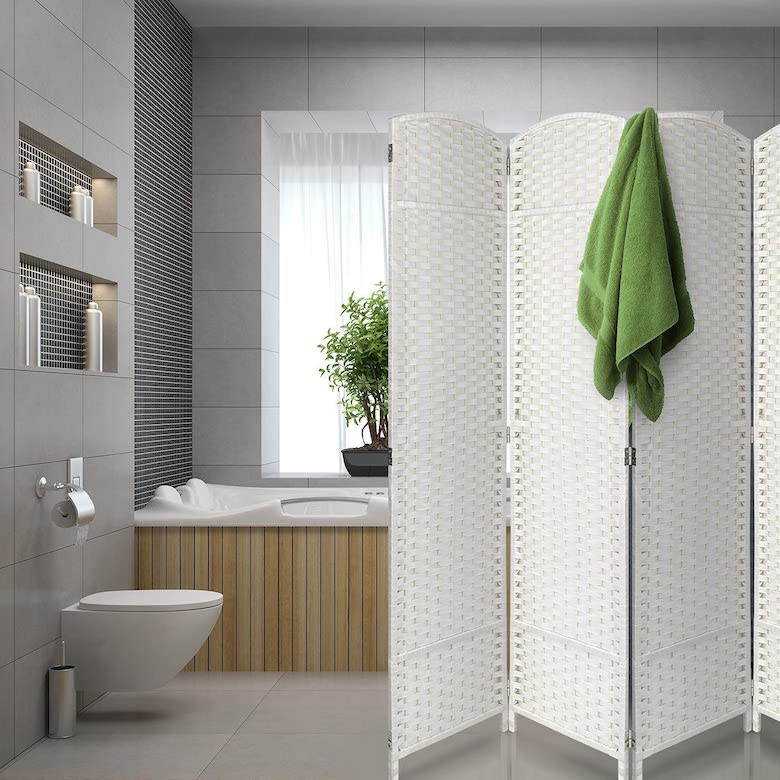 Bathroom with white woven room divider