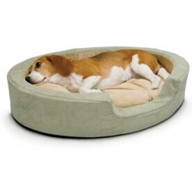 A beagle relaxing on a plush oval pet bed with raised sides