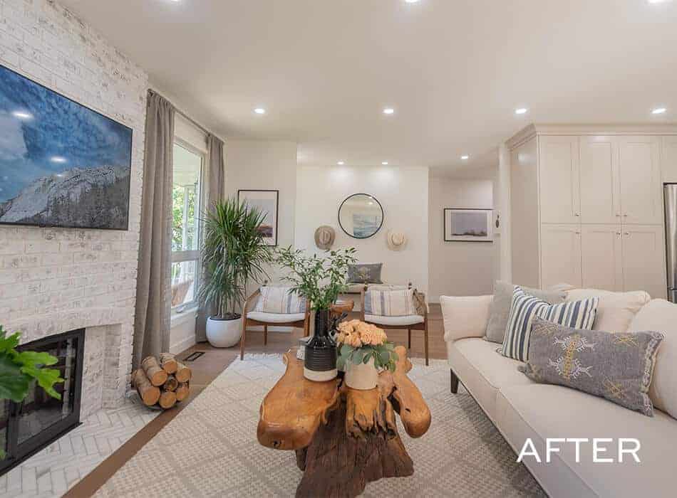 After image of a modern living room with a white brick fireplace, a large TV, and comfortable seating arrangements