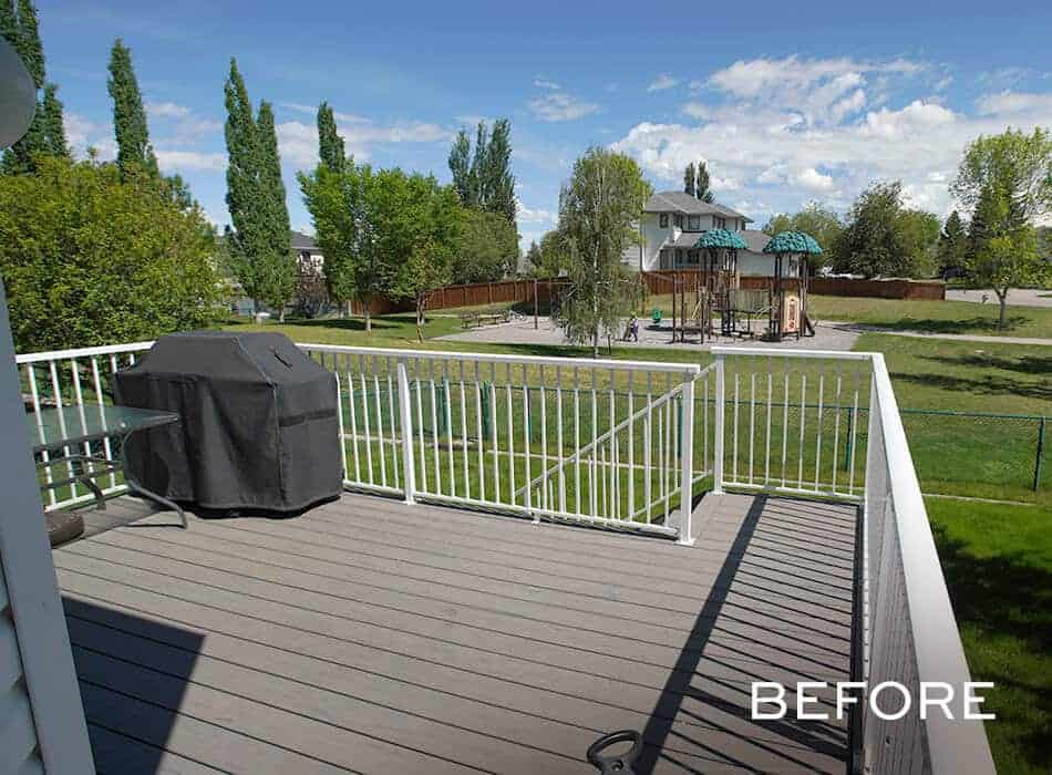 Outdoor deck with railing, grill, and playground view