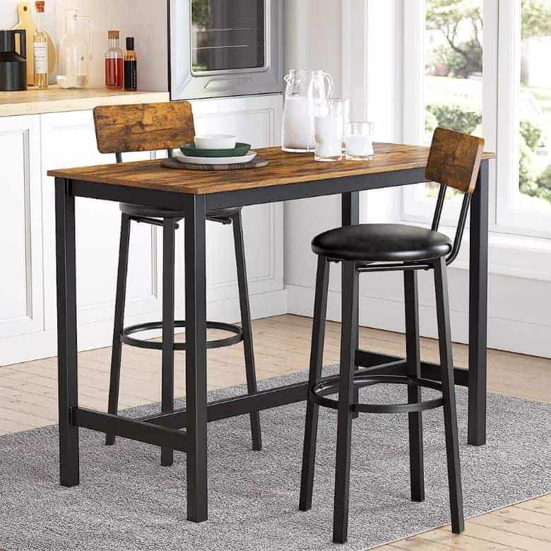 Modern kitchen with high dining table and two chairs