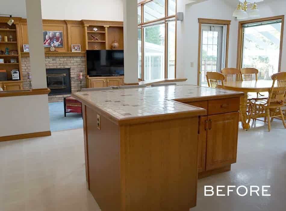 Traditional kitchen with wood cabinets, tiled island, and dining area