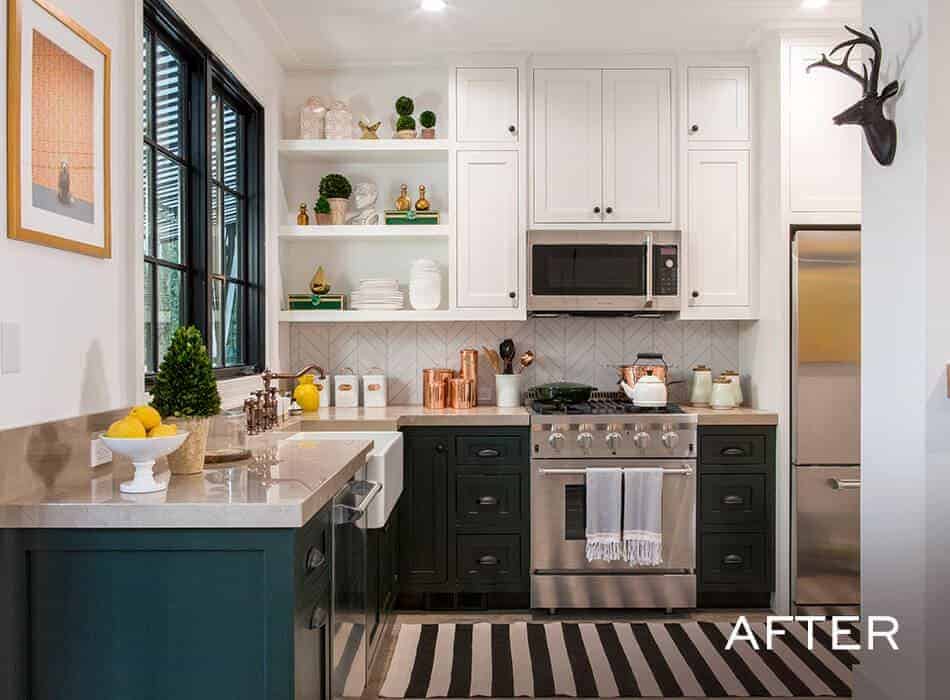 Modern kitchen with white cabinets, stainless steel appliances, and striped rug