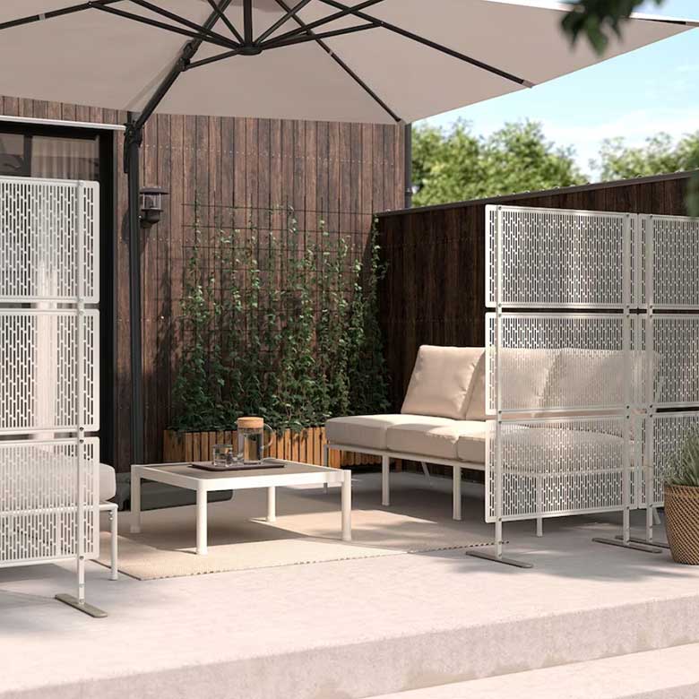 Outdoor patio with umbrella and privacy screens