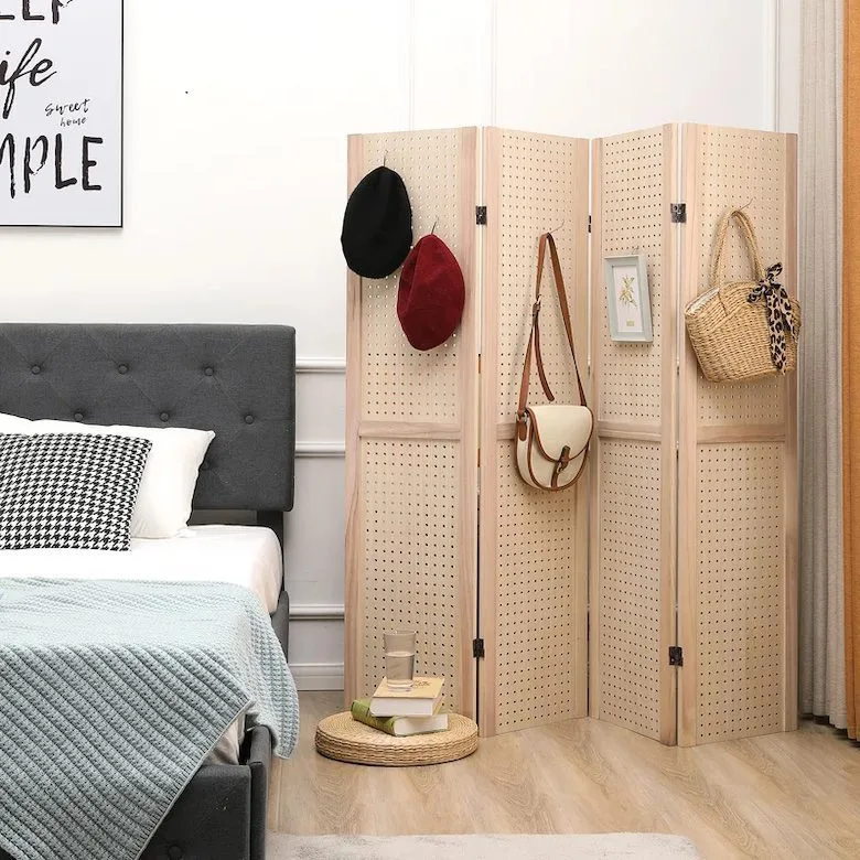 Bedroom with pegboard room divider