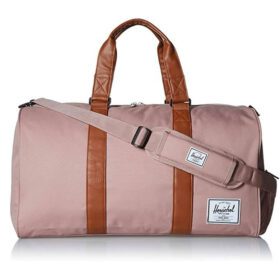 Pink duffel bag with brown leather accents and an adjustable shoulder strap