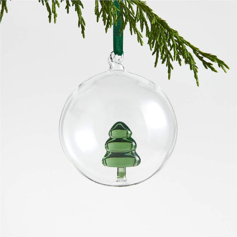 glass globe ornament with christmas tree in it