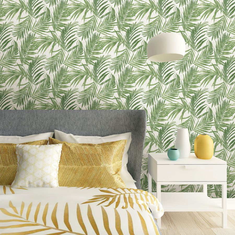 Bedroom with green frond wallpaper and yellow accents