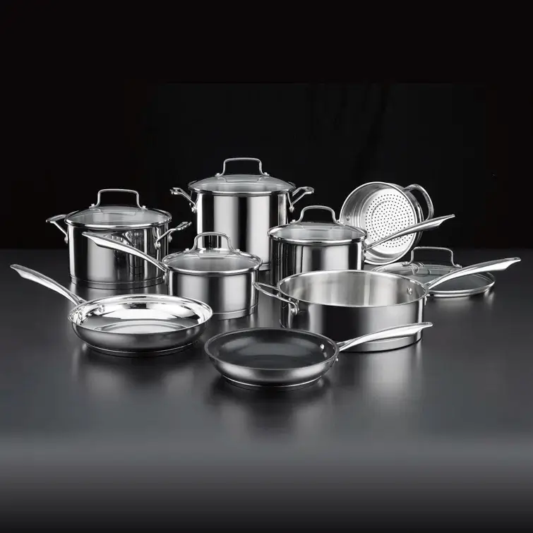 Pots and pans in front of a black backdrop