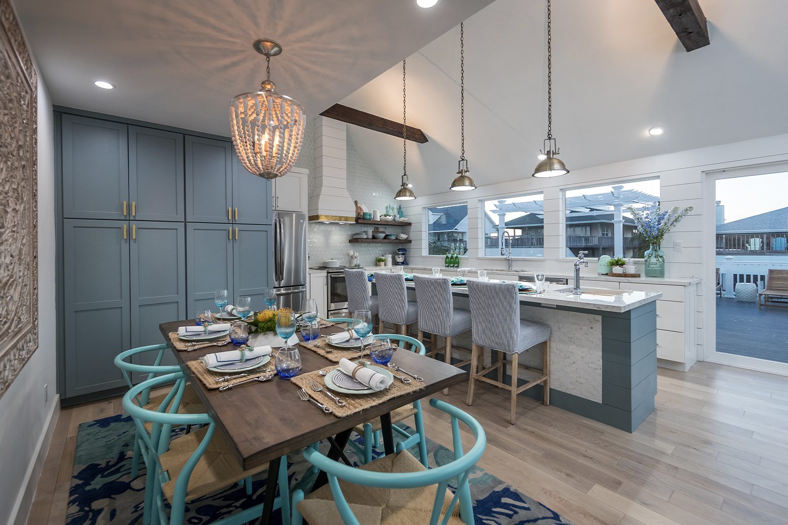 brother vs brother reveal team drew bright blue kitchen chairs and open concept floorplan