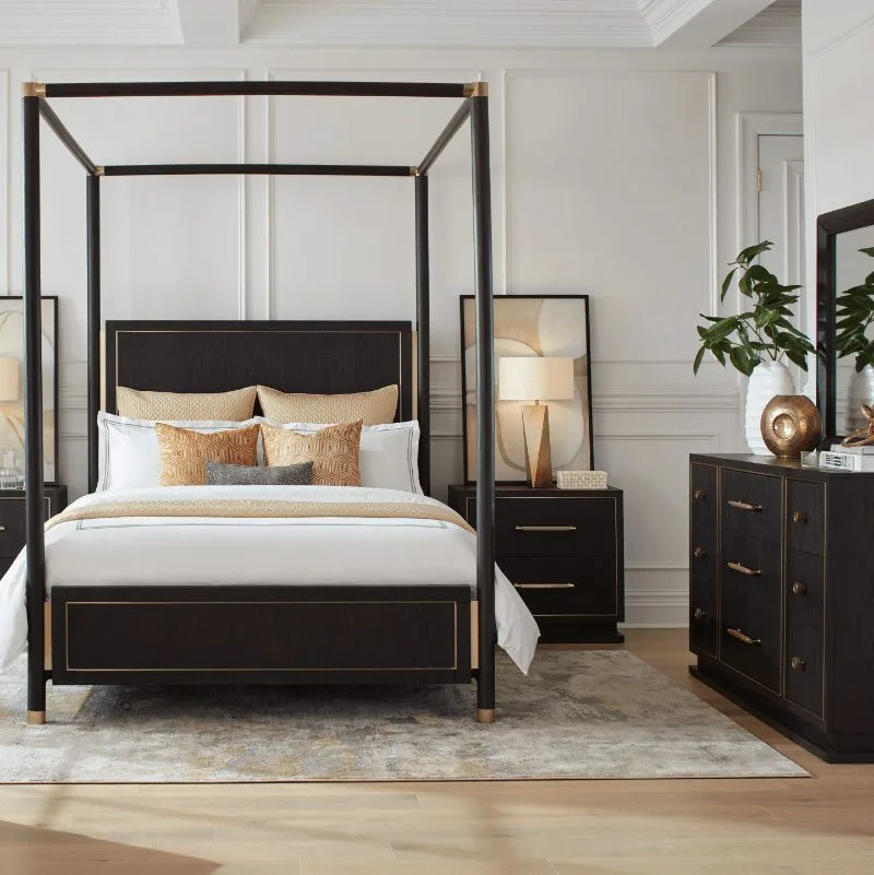 canopy bed and dresser in a bedroom