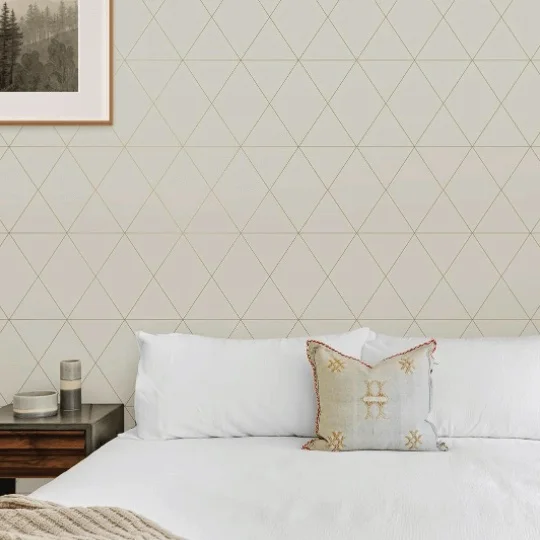 geometric wallpaper behind bed