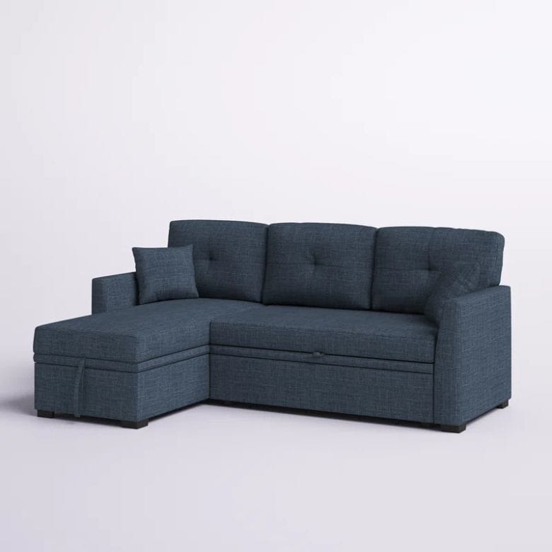 blue tufted sleeper sofa with left facing chaise
