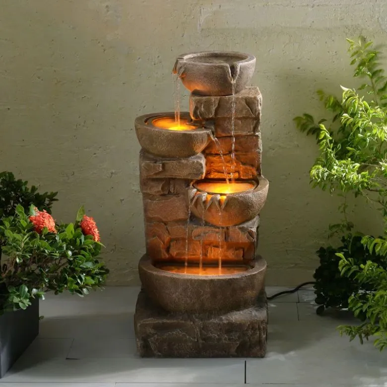 cascading stacked bowls and stone outdoor fountain