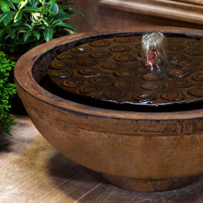 brown cast stone round outdoor fountain