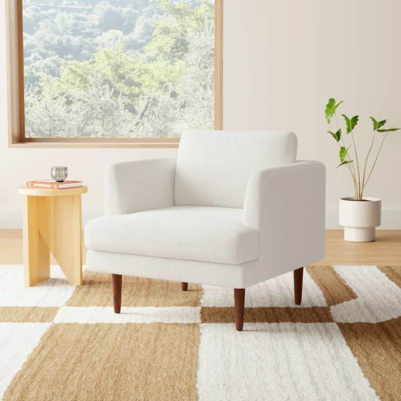 white boucle upholstered arm chair