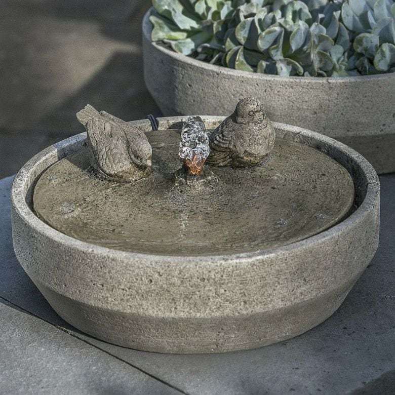 concrete and graystone fountain with decorative bird accents
