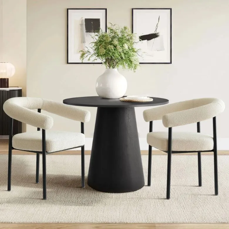 black round pedestal table with 2 upholstered chairs