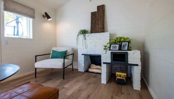 White fireplace in renovated space