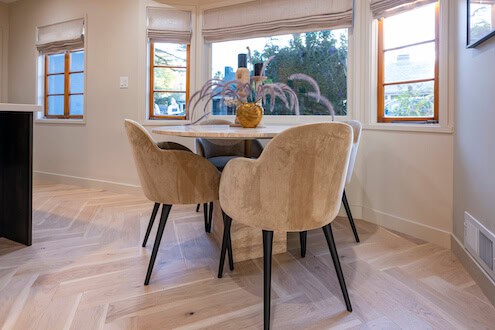 Kitchen table in front of windows