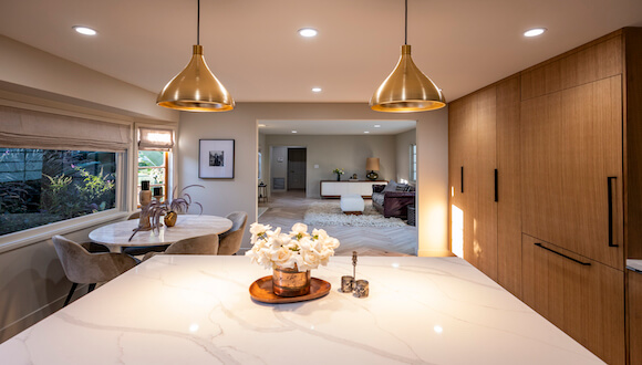 Gold ceiling lights above kitchen island